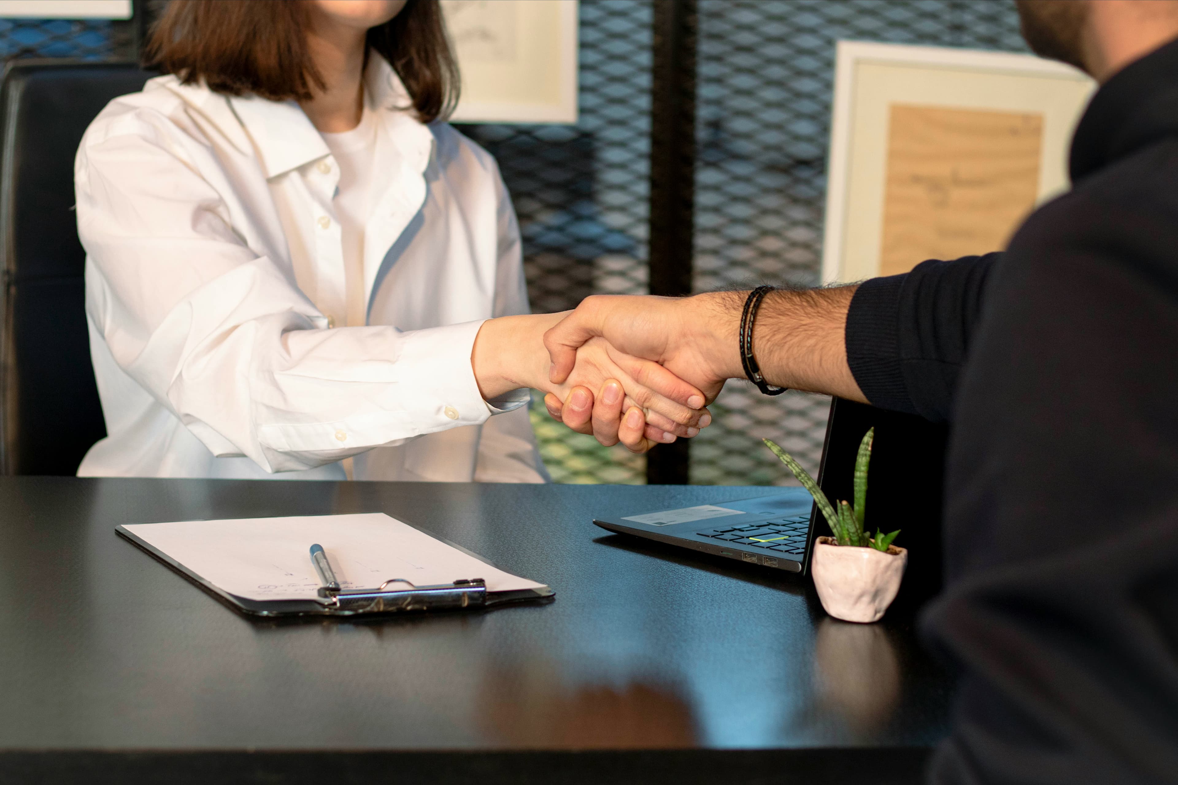 Notes and spreadsheets showing compensation benchmarks for Canadian small businesses