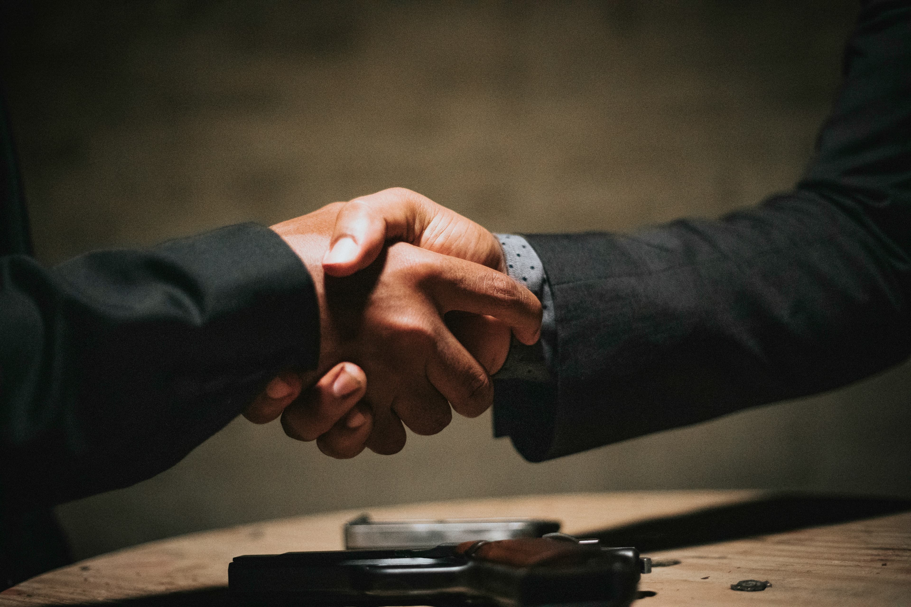 Canadian small business owner discussing competitive pay with an employee