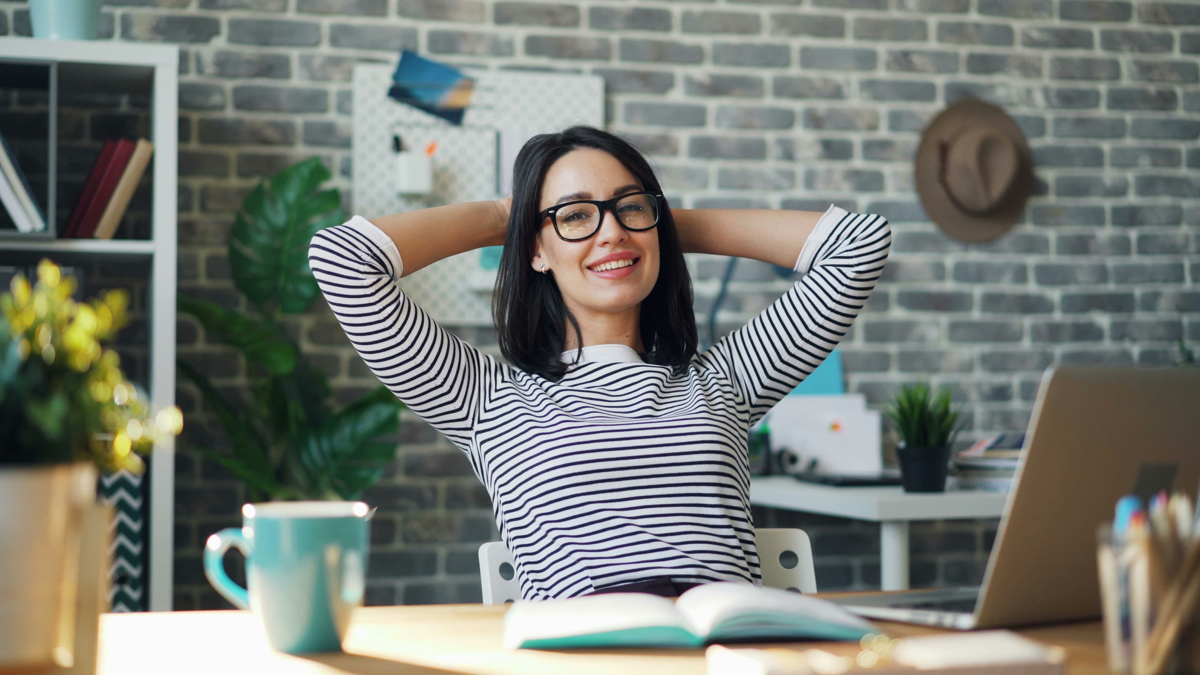 Canadian small business employees enjoying workplace benefits in a modern office